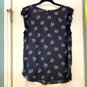 Short ruffle sleeved blouse. Charcoal gray with lavender print. Size M